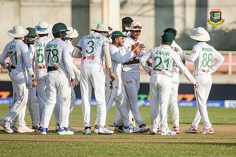 Bangladesh players celebrate after taking a wicket