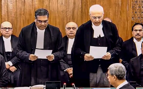 Chief Justice of India Sanjiv Khanna administers the oath of office to Justice Manmohan as a judge of the Supreme Court, in New Delhi, Thursday, Dec. 5, 2024.