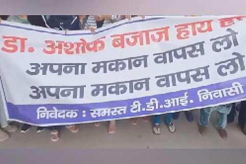Slogans and a banner were raised by the members of the housing society after they came to know that one Dr Ashok Bajaj had sold his house to Dr Ikra Chaudhary.