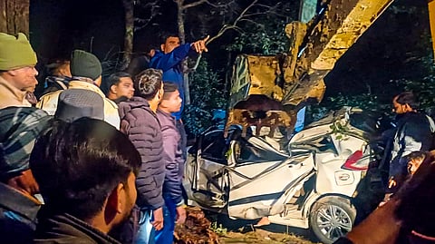Rescue work underway after a car crashed into a tree and plunged into a ditch, in Pilibhit, Uttar Pradesh, Friday, Dec. 6, 2024. At least six people were killed in the accident.