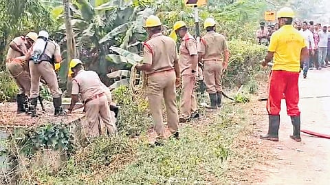 Fire service personnel trying to retrieve Parimal’s body from the sump