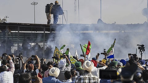 Tear gas being used by security personnel to disperse the farmers moving towards barricades during their foot march to Delhi, at Shambhu border in Patiala district.