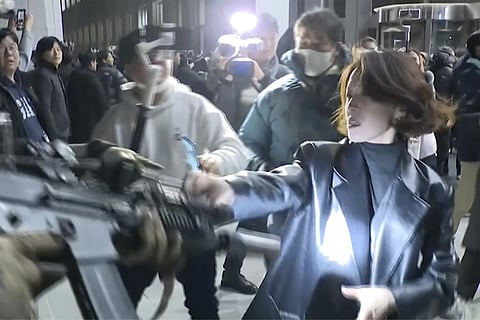 In this image made from a video, An Gwiryeong, front right, confronts one of the soldiers as parliamentarians scrambled to get inside the National Assembly building to reverse martial law, in Seoul, Dec 4, 2024.