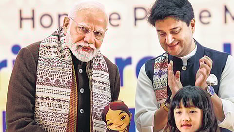 PM Narendra Modi being felicitated by a child during the ‘Ashtalakshmi Mahotsav’ at the Bharat Mandapam in New Delhi on Friday.