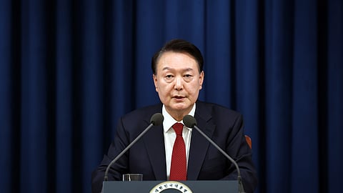 In this photo provided by South Korea Presidential Office, South Korean President Yoon Suk Yeol speaks during a press briefing at the presidential office in Seoul, South Korea, Tuesday, Dec. 3, 2024.