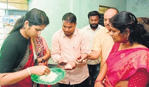 Sangareddy Collector Valluru Kranthi checkinng the quality of food.
