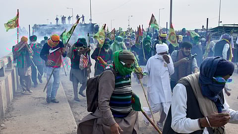 Tear gas being used to disperse protesting farmers at Shambhu Border during their foot march towards Delhi, in Patiala district, Sunday.