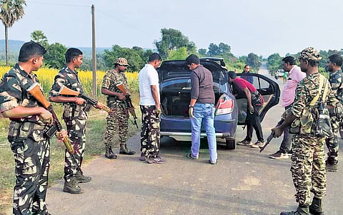 Police check a car during vehicle inspection on Monday.