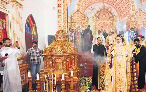 Moran Mor Ignatius Aphrem II, Patriarch of Antioch and all the East, offers incense at the tomb of former Catholicos of Jacobite Syrian Orthodox Church Aboon Mor Baselios Thomas I at St Athanasius Cathedral in Puthencruz