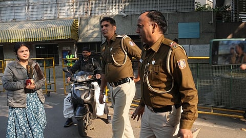 Police personnel outside DPS RK Puram during an investigation after the school received a bomb threat, in New Delhi last week.