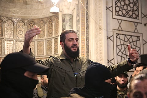The leader of Syria's Islamist Hayat Tahrir al-Sham (HTS) group that headed a lightning rebel offensive snatching Damascus from government control, Abu Mohammed al-Jolani, addresses a crowd at the capital's landmark Umayyad Mosque on December 8, 2024.