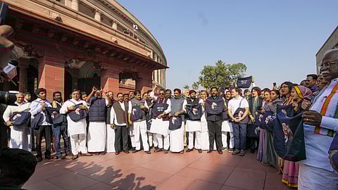 LoP in the Lok Sabha and Congress MP Rahul Gandhi with party MPs Priyanka Gandhi Vadra, K Suresh, KC Venugopal, and other INDIA bloc MPs stage a protest over indictment of industrialist Gautam Adani by a US court in a bribery case, during the Winter session of Parliament, in New Delhi.