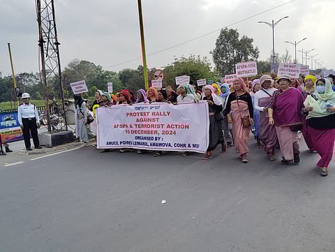 People taking part in the "Protest Rally against AFSPA & Terrorist Action" on International Human Rights Day.