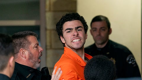 Suspect Luigi Mangione is taken into the Blair County Courthouse on Tuesday, Dec. 10, 2024, in Hollidaysburg, Pa.