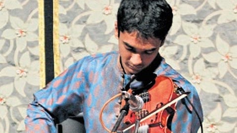 L Subramaniam and Ambi Subramaniam perform at a concert