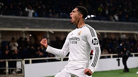 Real Madrid's English midfielder #05 Jude Bellingham celebrates scoring his team's third goal during the UEFA Champions League football match between Atalanta and Real Madrid