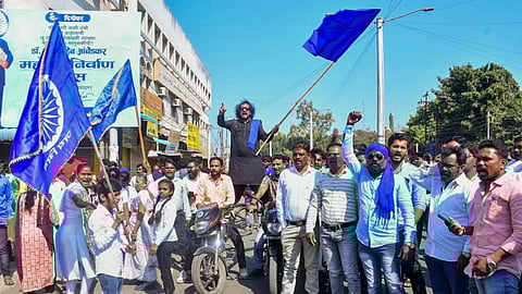 Agitators during a protest which continued for the second day over alleged vandalizing of a replica of the Indian Constitution, in Parbhani, Maharashtra, Wednesday, Dec. 11, 2024.