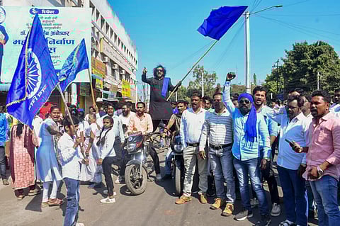 Agitators during a protest which continued for the second day over alleged vandalizing of a replica of the Indian Constitution, in Parbhani, Maharashtra, Wednesday, Dec. 11, 2024.