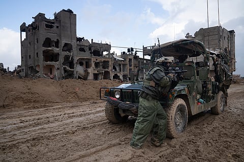 An Israeli soldier stands guard in Khan Younis, Jan. 27, 2024.