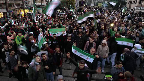 An aerial picture shows people gathering to celebrate in Syria's western port city of Latakia on December 11, 2024.