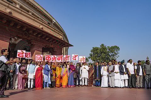 Congress and other opposition parties' MPs stage a protest demonstration during the Winter session of Parliament, in New Delhi.