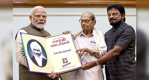 Prime Minister Narendra Modi with noted scholar Seeni Viswanathan, second right, releasing the compendium of complete works of Bharathi in New Delhi.