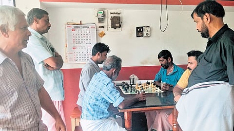 Marottichal residents playing chess at Unnikrishnan’s tea shop.