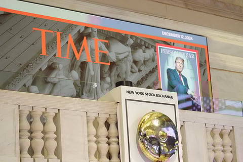 A cover of Time magazine's person of the year, shows President-elect Donald Trump, before he arrives to ring the opening bell at the New York Stock Exchange on Thursday.