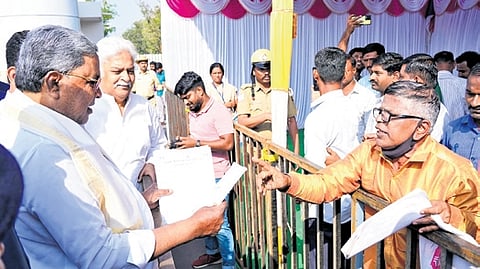 People submit petitions to CM Siddaramaiah in Vijayapura on Friday