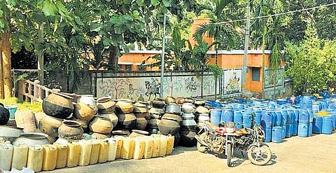 The illicit liquor and containers seized from the illegal units in Khallikote area