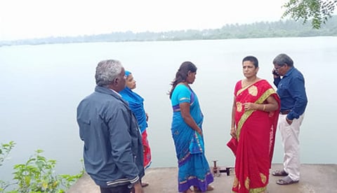 Officials inspecting the Thenkaraikottai lake where the bund of the lake observed a crack.