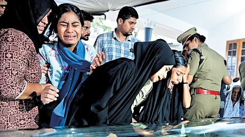 Classmates break down as the mortal remains of one of the victims of the Panayampadam accident are brought home on Friday