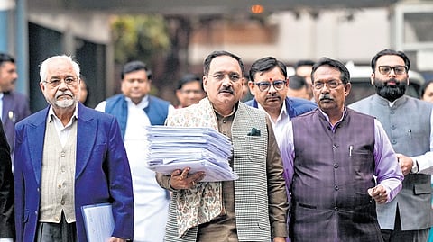 Delhi BJP president Virendra Sachdeva (holding papers) and others after a meeting with Election Commission officials at Nirvachan Sadan on Friday | PTI