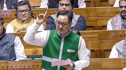 Union Minister for Parliamentary Affairs and Minority Affairs Kiren Rijiju speaks in the Lok Sabha during the Winter session of Parliament, in New Delhi.