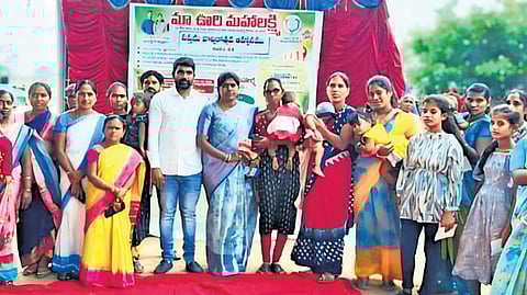 Parents of girl children receive the deposit amount in a function at Kondaayyapally