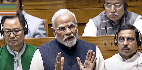 Prime Minister Narendra Modi speaks in the Lok Sabha during the discussion on the 'glorious journey of 75 years of the India Constitution', in the ongoing Winter session of Parliament, in New Delhi.