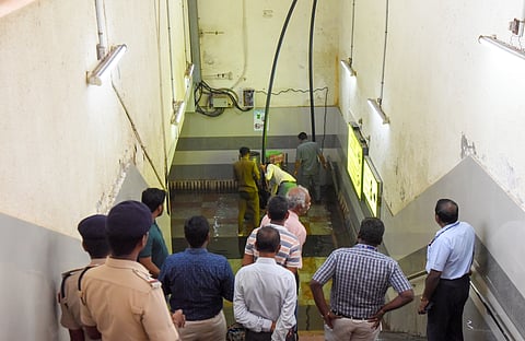 Tiruchy Divisional Railway Manager M S Anbalagan monitoring the works to drain out the storm water accumulated in the subway on Saturday