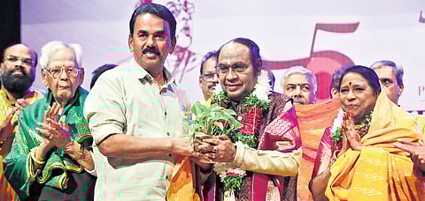 Minister Jupally Krishna Rao honours Yella Venkateshwara Rao in Hyderabad on Sunday.