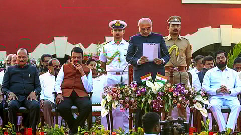 Maharashtra Governor CP Radhakrishnan, Chief Minister Devendra Fadnavis, Deputy Chief Ministers Ajit Pawar and Eknath Shinde and others during the swearing-in ceremony of cabinet ministers amid state cabinet expansion, at Raj Bhavan, in Nagpur, Sunday, Dec. 15, 2024.