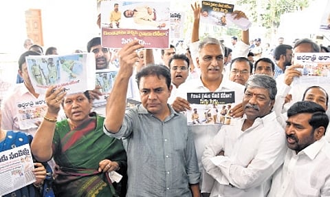BRS MLAs stage a protest outside the Assembly