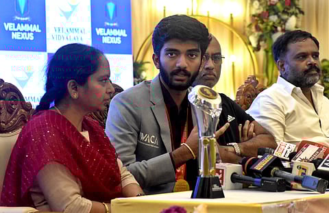 D Gukesh with his parents during a press meet in Chennai on Monday.