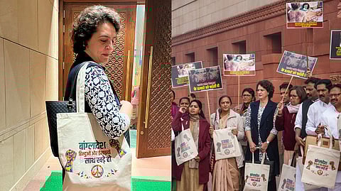 Congress MP Priyanka Gandhi Vadra carries a bag with the message 'stand with Hindus and Christians of Bangladesh' to Parliament on Tuesday, Dec. 17, 2024.