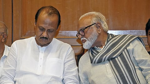 Maharashtra Deputy Chief Minister Ajit Pawar (L) with senior Nationalist Congress Party (NCP) leader Chhagan Bhujbal (R).
