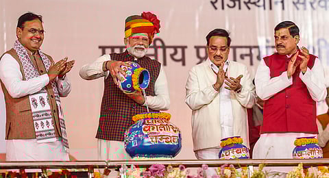 Prime Minister Narendra Modi with Union Minister of Jal Shakti C R Patil, Rajasthan Chief Minister Bhajanlal Sharma, and Madhya Pradesh Chief Minister Mohan Yadav during the 'Ek Varsh-Parinaam Utkarsh' event, marking the completion of one year of Rajasthan government, in Jaipur, Tuesday, Dec. 17, 2024.