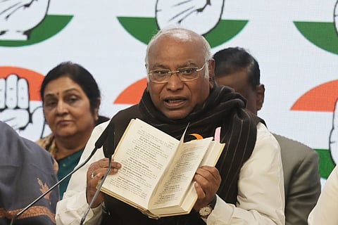 Congress president Mallikarjun Kharge addresses a press conference at AICC HQ in New Delhi on Wednesday.