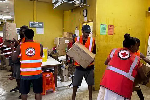 In this image released by Vanuatu Red Cross Society, its volunteers assist staff with the clean up at Vila Central Hospital in Port Vila, Vanuatu Wednesday, Dec. 18, 2024, following a powerful earthquake that struck just off the coast of Vanuatu in the South Pacific Ocean.