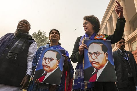 LoP in the Rajya Sabha and Congress President Mallikarjun Kharge with party MP Priyanka Gandhi Vadra and DMK MP Kanimozhi Karunanidhi during a protest by the INDIA bloc members in Parliament premises