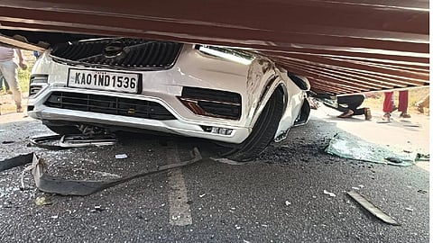 Six people were killed when a container truck overturned on their car at Nelamangala on Saturday, police said.