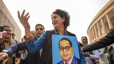 Congress MP Priyanka Gandhi Vadra and other INDIA bloc MPs during a protest against Home Minister Amit Shah over his remarks related to B R Ambedkar, at Parliament, in New Delhi.