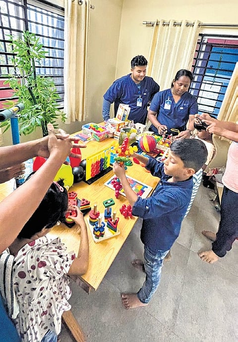 Children playing at the toy library Wonder Box at AMHA